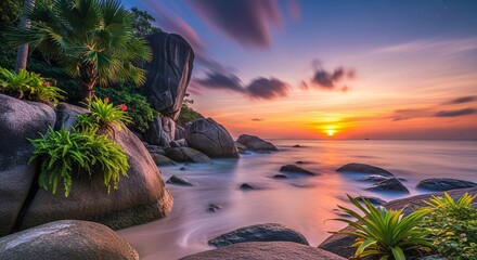 Serene tropical beach at sunset with vibrant sky and calm ocean reflecting the golden light.