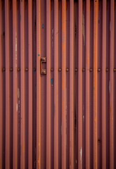 Rustic corrugated metal texture background with rich, aged rust tones and visible wear. Ideal for industrial, grunge, or vintage designs, surface, roofing, grunge