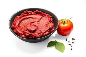 Fresh tomato paste or puree on a white background	