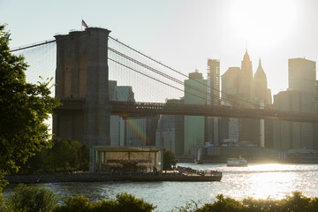 brooklyn bridge and manhattan financial district skyline with jane's carousel underneath
