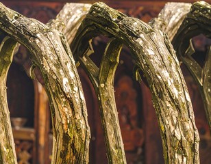 Close-up of weathered, ornate wooden arch details