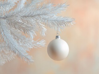 Elegant macro of white Christmas tree branch with single ornament for festive decor