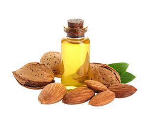 Almond oil in a small glass bottle, surrounded by whole almonds and leaves