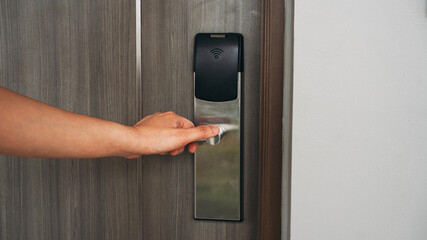 Electronic card key for open door in hotel. Smart card key to lock and unlock door. Security systems and protection concept.
