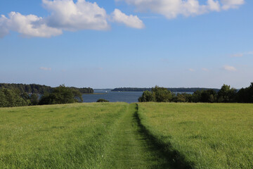 Landscape lake, grass and sky