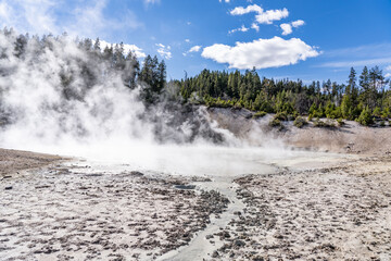 Mud Caldron. Mud Volcano area, Yellowstone National Park, Wyoming. A mud volcano or mud dome is a landform created by the eruption of mud or slurries, water and gases