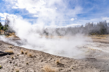 Churning Caldron. Mud Volcano area, Yellowstone National Park, Wyoming. A mud volcano or mud dome is a landform created by the eruption of mud or slurries, water and gases