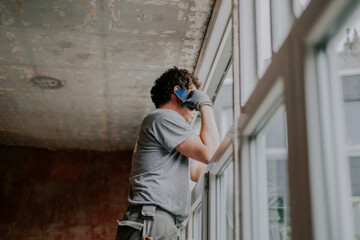 Portrait of a handyman talking on a smartphone.