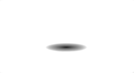 A blurry black spot on a white background, creating a simple and minimalist image.