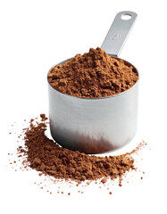Measuring cup filled with dark brown powder, spills around