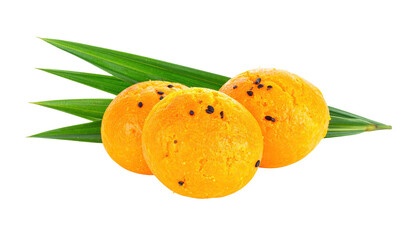 Three round, bright orange treats, nestled together, with dark specs.  Green palm leaves extend behind and above