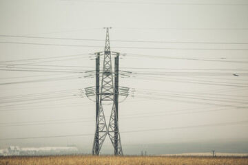 High Voltage Poles or Electric tower is transmission high voltage power locate on green field -...