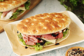 Panini sandwich with prosciutto in Italian style