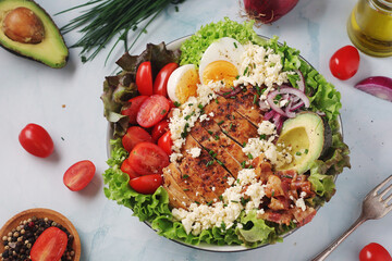 A bowl with cobb salad, traditional American dish	