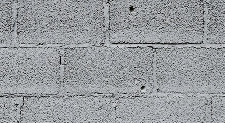 Close up of a grey concrete cinder block wall texture background.