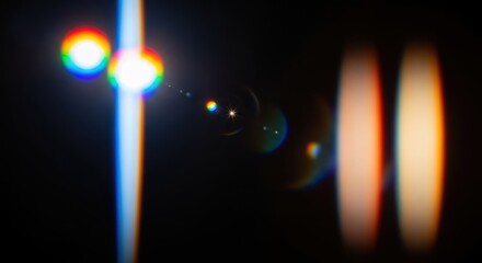 Abstract light streaks and flares with rainbow chromatic aberration on black background