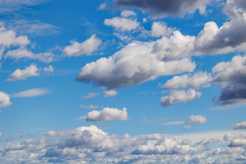 White clouds on a blue sky during summer in Poland