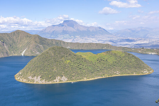 Cotacachi, Ecuador - August 5, 2025: Close-up of Teodoro Wolf Island located within the beautiful Cuicocha Lagoon. The Imbabura Volcano can also be seen in the background.