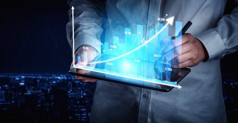 A businessman analyzes data using a digital tablet, showcasing a growth chart against a stunning...