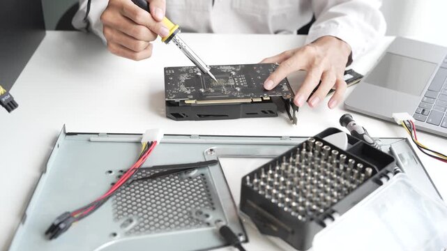 Closeup hand of computer hardware technician dissemble and  fixing computer PC.