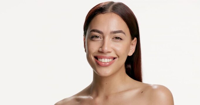 Studio, beauty and woman with face spray, hydration or facial mist for healthy skin and moisturizer. White background, cosmetics and person with product for makeup, self care and skincare with water