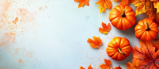 Autumn Pumpkins with Red and Orange Fall Leaves