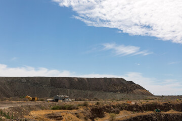 mine tailings at a diamond mine in Africa, leftover materials from ore processing, after the valuable minerals have been separated