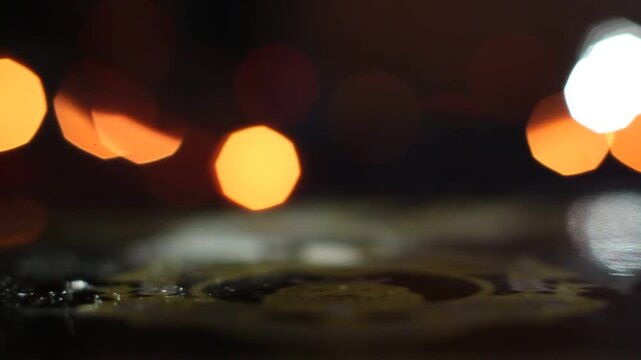 Macro shot of a sewing machine needle rapidly stitching red fabric. Bokeh effect of colorful Christmas lights twinkles in the dark background, ideal for holiday crafting themes. - Powered by Adobe