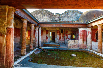 Inside of a Pompeii household, with frescos and colour still visible