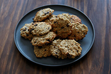 Oatmeal banana cookies with chocolate chips on rustic table