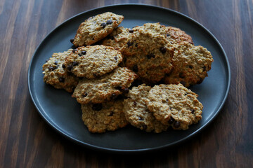 Fresh baked oatmeal banana chocolate chip cookies on plate
