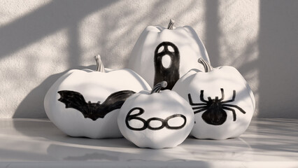 Black and white pumpkins decorated with silhouettes of spider, bat, ghost and boo word. Pumpkins painted in monochrome colors, decorated decoupage technique. Home decoration for Halloween