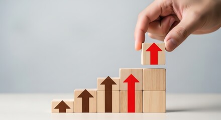 Hand placing last block with upward arrow to complete graph