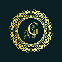 Elegant golden monogram letter g emblem with intricate floral mandala design on dark background