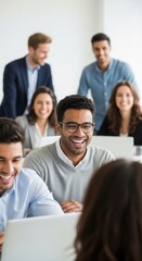 Fototapeta premium Group of diverse happy professionals actively engaging in a bright modern workspace, smiling and laughing during a collaborative meeting, enjoying conversation and learning at desks.