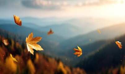Golden leaves drift across a blurred mountain vista at sunset