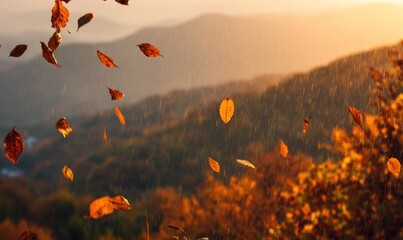 Autumn leaves swirl against a backdrop of hazy mountain silhouettes in soft sunlight