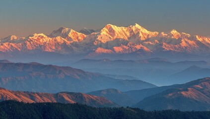 Majestic snow-capped mountains glow at sunrise, layered by rolling forested ranges