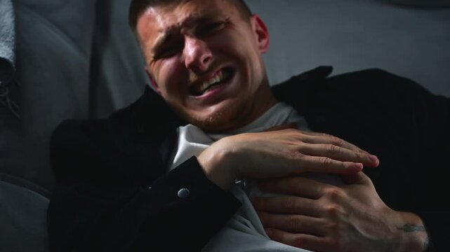 A young man with severe chest pain during a heart attack.
Heart pain due to high blood pressure, strain, and stress.
Sharp heart pain.
Chest, heart, arrhythmia, panic