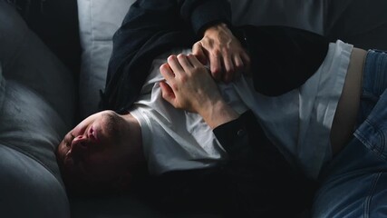 A man screaming for emergency help clutches his chest with his hands and experiences chest pain.
Panic attack and cardiac problems in young people.
Heart, heart attack, health, help, screaming