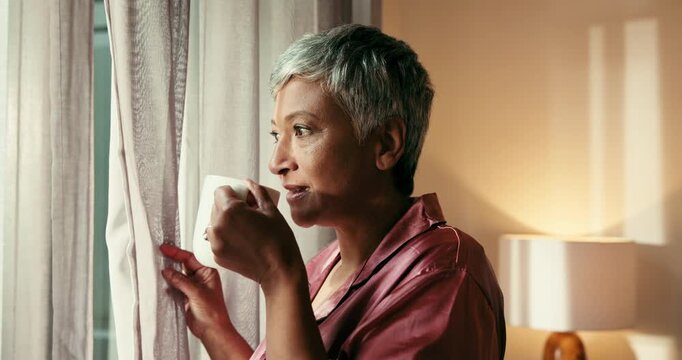 Coffee, thinking and window with senior woman in home for memories, nostalgia and morning. Relax, smile and wellness with happy mature person drinking caffeine beverage in apartment for weekend