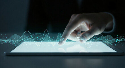Close up of hand touching glowing digital sound wave graph on futuristic tablet screen