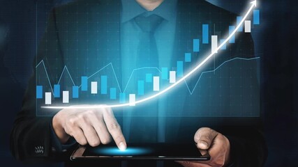 A businessman uses a digital tablet to analyze stock market trends, showcasing financial graphs and data visualization to strategize investment growth. Copula - Powered by Adobe