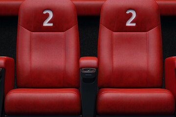 Empty comfortable red seats with numbers in cinema