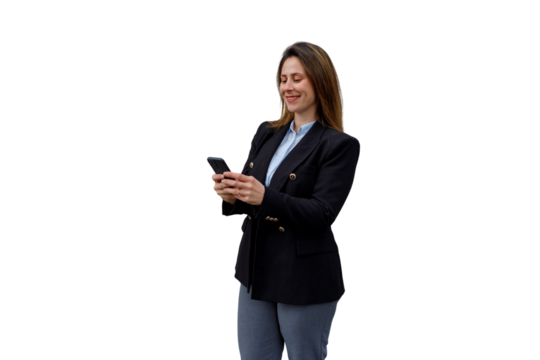 Smiling businesswoman interacting with smartphone, texting and communicating, standing in business casual attire