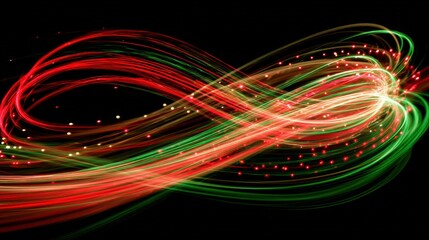 A dynamic, abstract image of red and green light trails swirling on a black background. Represents festive energy and movement.