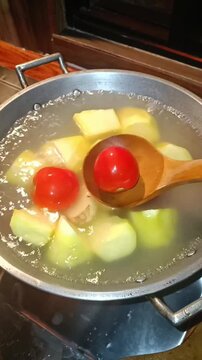 add tomatoes to kamote that has been simmered in water or broth. 