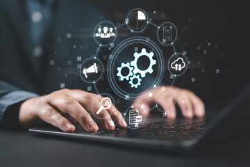 Business process automation BPA and robotic process automation RPA systems. API automation and data transfer with system integration. Businessman using laptop computer.