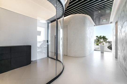 Modern dental office interior with reception desk, patient chairs, treatment rooms and professional equipment. Bright clean environment designed for healthcare and dentistry services, including x-ray 