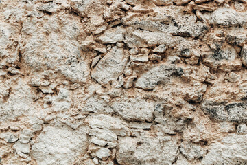 Texture of a rock made of stones of irregular shape and size.